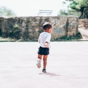 image of a running child as a physical activity